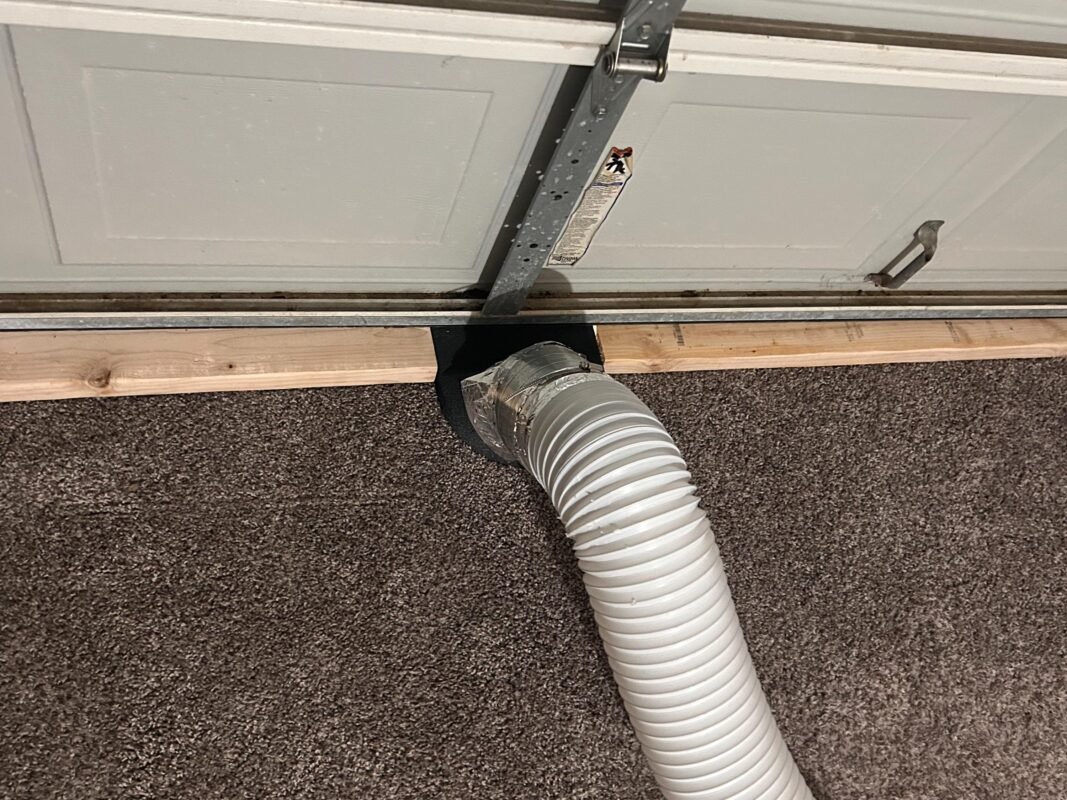 Under Garage Door 2x4 Seal Exhaust Smoke Laser Duct Shroud Review by Amber 4 a white pipe on a white surface