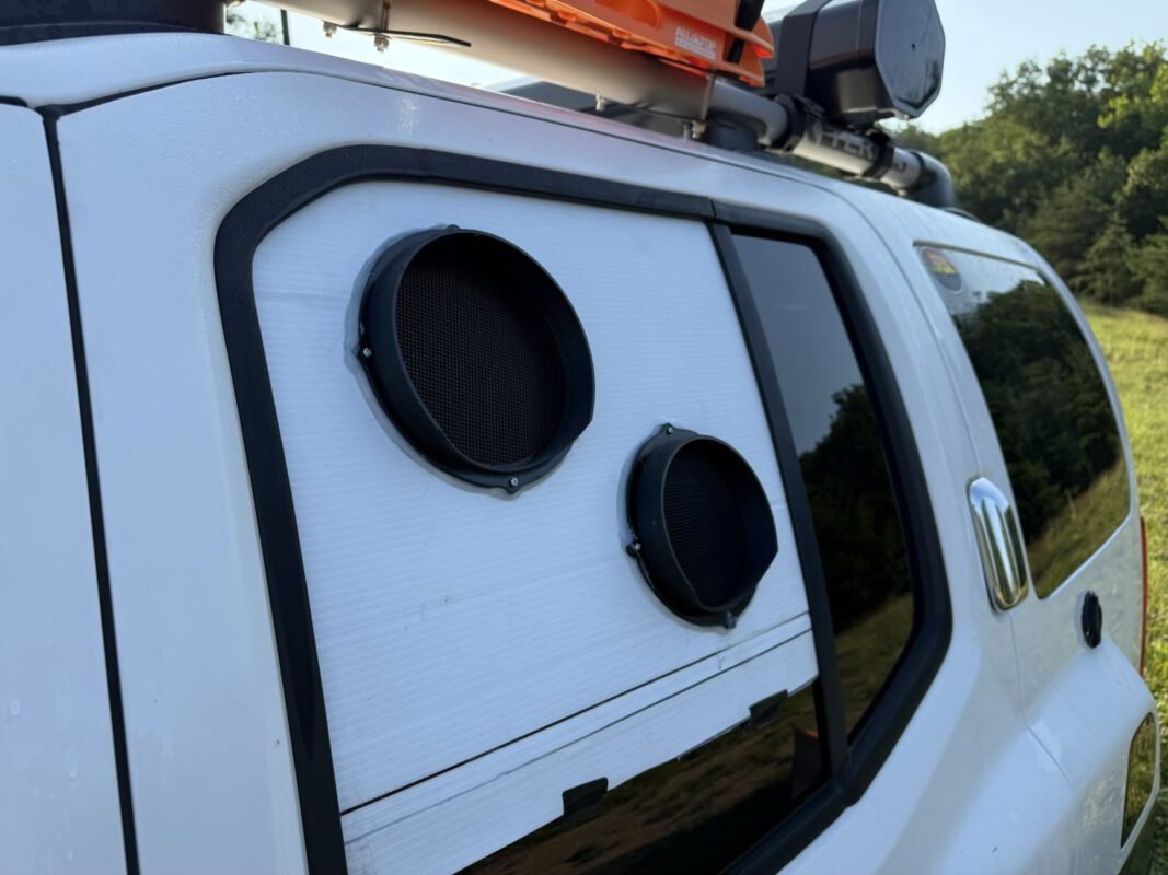 EcoFlow Wave Mounted in an Xterra SUV DIY Window Kit 4 a white vehicle with speakers on the side