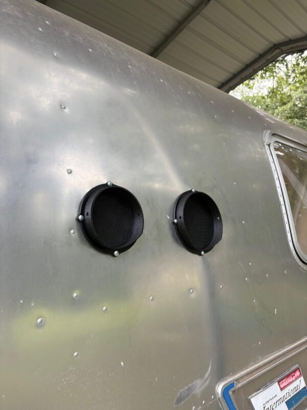 Venting Hvac in an AirStream Travel Trailer 3 a metal trailer with round black round holes